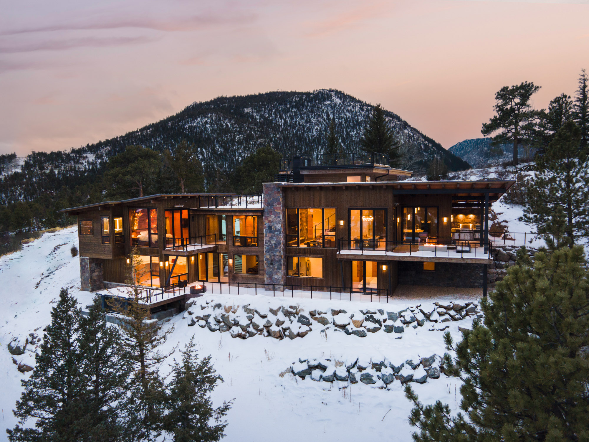 aerial view of a luxury home in the snow